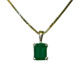 Green gemstone pendant on a gold chain against a white background