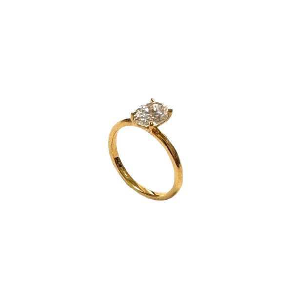Gold ring with a diamond on a white background
