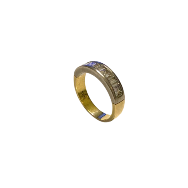 Gold ring with embedded stones on a white background
