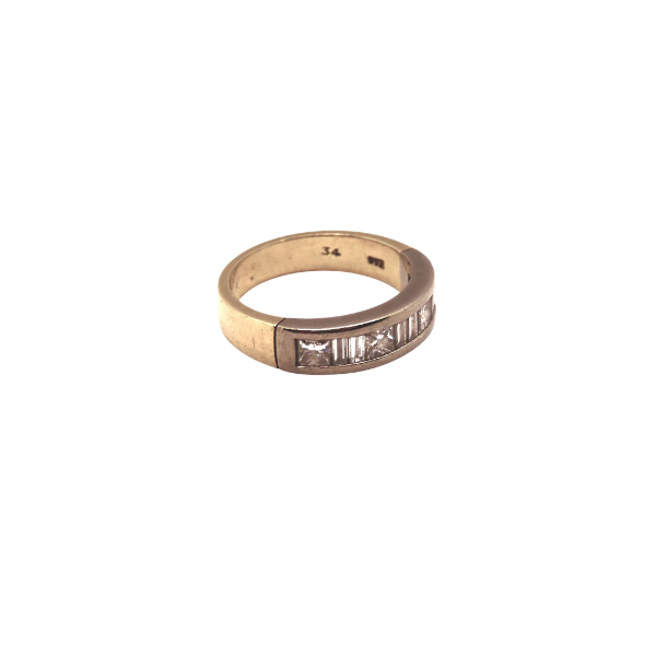 Gold ring with diamond on a white background